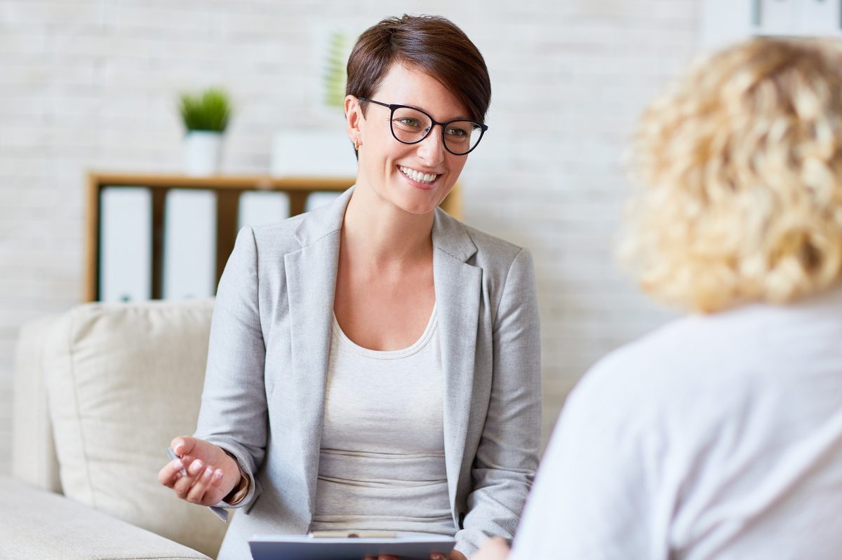Successful psychologist talking to her patient